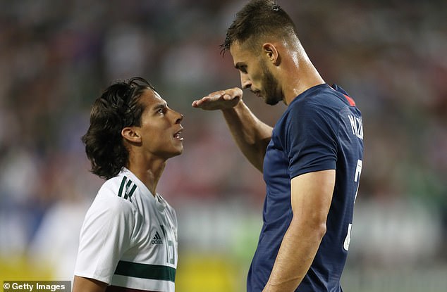 United States defender Matt Miazga (right) mocks the height of Mexico's Diego Lainez