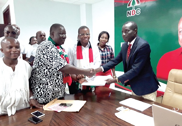 Joe Gidisu (2nd left) presenting the nomination forms of Mr Abodakpi to Mr Justice Afum at the ceremony