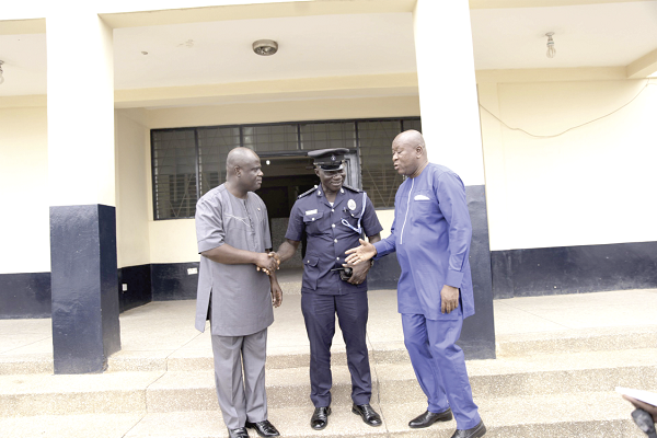  Mr Prince Armah (left)  and Baba Anaba (right), Administrative Manager, Euroget, exchanging pleasantries with DSP James Asiedu after handing over the refurbished Police Station (left)