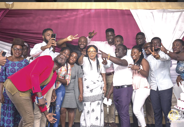 Staff and old students celebrating with the headmistress of the Light of the World School, Mrs Esther Hamilton (arrowed)