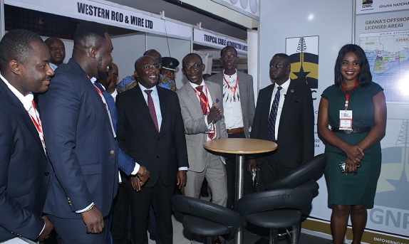Dr Kwame Baah-Nuakoh (4th left), General Manager, Sustainability of GNPC, briefing the Vice-President Dr Mahamudu Bawumia (3rd left) and some officials at the GNPC’s exhibition stand. Picture: GABRIEL AHIABOR