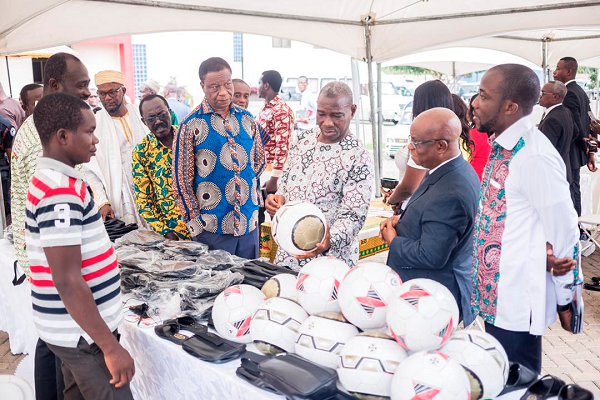 Mr Darfour,  the Eastern Regional Minister (middle), with the Volta Regional Minister, (in suit)  inspecting a mini-exhibition after the opening ceremony of the conference. Looking on is Mr Dela Gadzanku,  Volta /Eastern AGI Chair (extreme left). 
