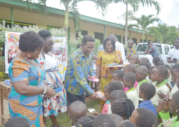  Prof. Kwesi Yankah, (arrowed) distributing educational materials to new school pupils at the Nsaba Islamic Basic School. 