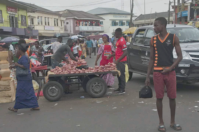 Some food vendors selling on the streets in Sekondi-Takoradi