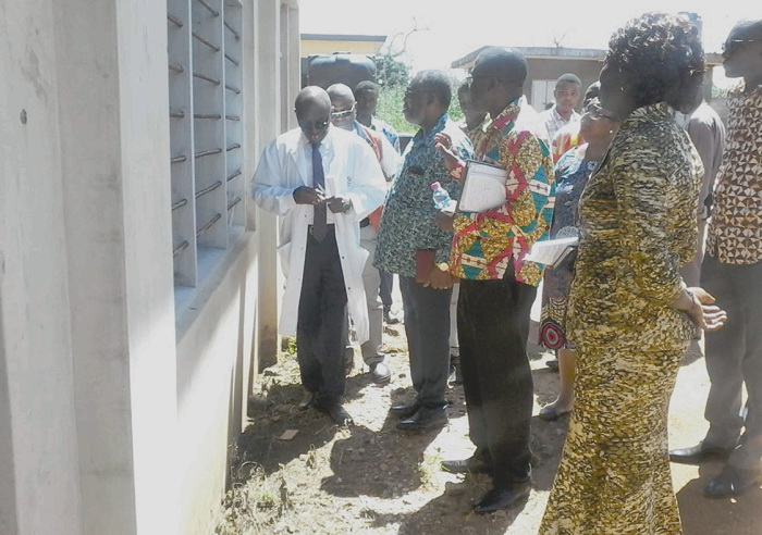 Dr William Gudu (left),  Dr Anthony Nsiah Asare (2nd left) and Dr Yao Yeboah (2nd right) touring the Bongo Hospital with some dignitaries