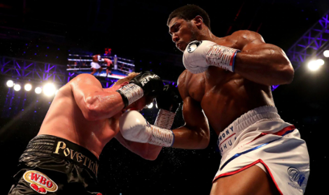 Anthony Joshua breaks through Alexander Povetkin's defence CREDIT: GETTY IMAGES