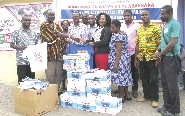 Ms Martha Anyiri (5th right) of the Corporate Communications Unit of GCGL presenting some items to Nii Tetteh Adjabeng II, Chief of Adabraka Atukpai. Picture: ESTHER ADJEI