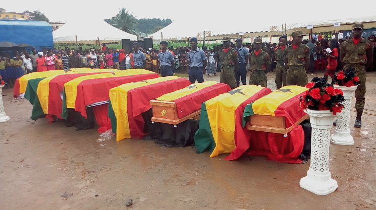 The caskets of the victims at the burial service