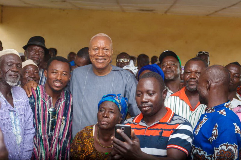 Prof Joshua Alabi interacting by some party people
