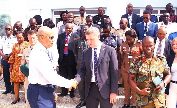  Air Vice-Marshall Griffiths Evans (left), Commandant, Kofi Annan International Peacekeeping Training Centre (KAIPTC), in an interaction with Mr Iain Walker (middle), the British High Commissioner in Accra. Also in the picture are Col Albert Dawohoso (right), Director of Training, KAIPTC and the other participants. Picture: NII MARTEY M. BOTCHWAY