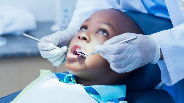 Dr Filson attending to a child.