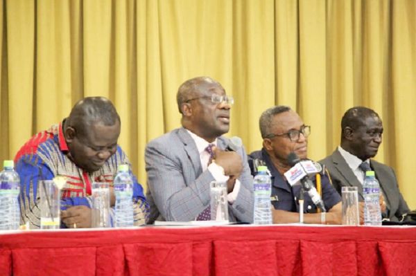  Mr Kofi Nti (2nd left) addressing the media during the interaction. Looking on are other commissioners of the GRA