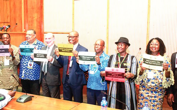 Ambassador Luis Alfonso de Alba (3rd left), the Special Envoy of the UN Secretary-General on Climate Action, Dr Nyong (Middle) and Mrs Patricia Appiagyei (right), the Deputy Minister of the Ministry of Environment, Science, Technology and Innovation, and some climate scientists displaying leaflets on climate actions at an Africa Cimate Week programme