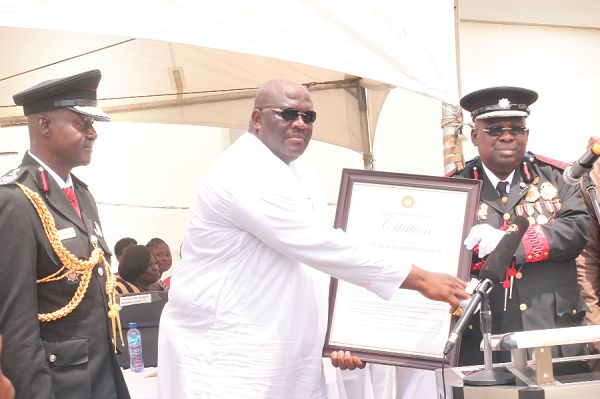 Mr Henry Quartey (middle), a Deputy Minister for the Interior presenting a citation to Dr Albert Brown Gaisie (right), the outgone Chief Fire Officer as the Chief Fire Officer, Mr Blankson looks on. Picture: NII MARTEY M. BOTCHWAY