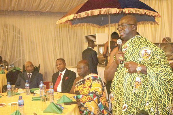 Nana Agyenim Boateng II (standing) speaking at the dinner for business executives in Kumasi. Those with him are Nana Effa Appenteng (2nd right), Bompatahene; Baffour Asare Amankwatia VI (3rd right), Bantamahene; and Mr Kofi Badu (1st left), the Chief of Staff, Manhyia Palace. Picture: EMMANUEL BAAH