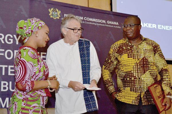 Mr Jan Helge Skogen (middle), Country Manager, presenting the plaque symbolising the start of Aker Energy’s support for the AOGC Programme to Mrs Samira Bawumia