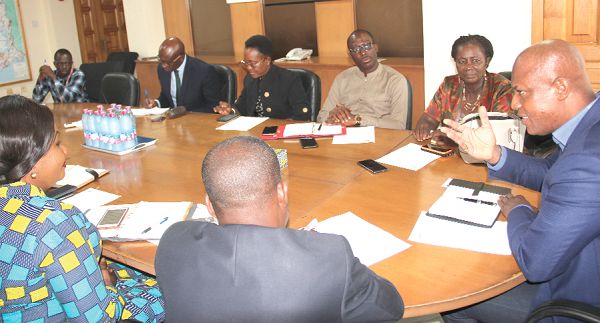 Mr Ato Afful (right), Managing Director, Graphic Communications Group Limited (GCGL) holding discussions with the IPR delegation at his office in Accra. Picture: EDNA ADU-SERWAA