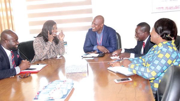 Ms Francoise Lubanda (2nd left), Director of External Affairs of the African Office, the Royal Commonwealth Society, explaining a point to Mr Benjamin Ato Afful (3rd right) while some officials of RCS and GCGL look on. Picture: EDNA ADU-SERWAA