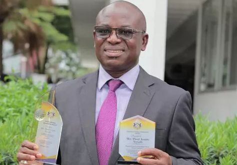 Mr Paul Asare Ansah displaying his awards