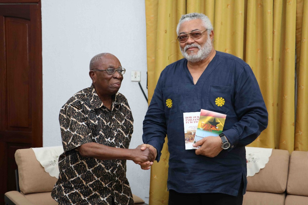 Former clerk of Parliament presents books to Rawlings