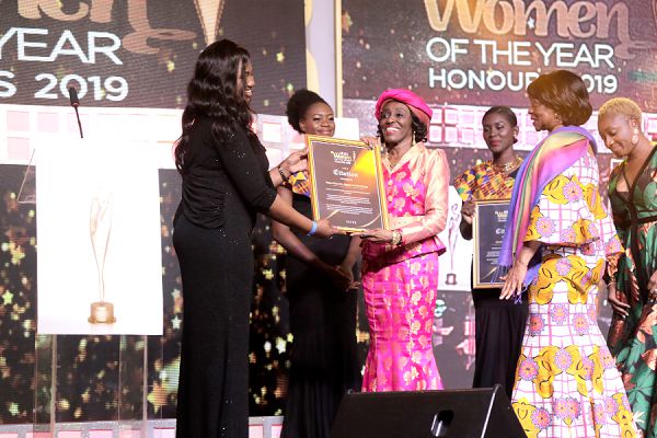 Nana Konadu Agyeman-Rawlings (2nd left), a politician and a former First Lady, receiving a special award
