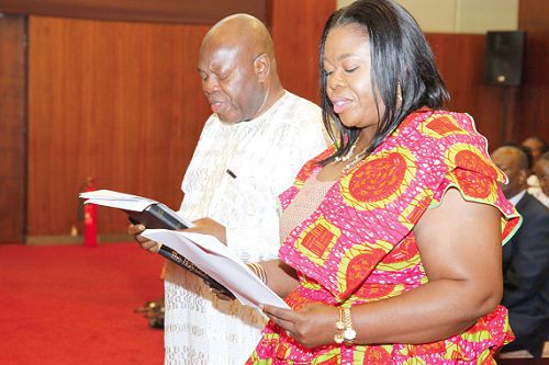 President Nana Addo Dankwa Akufo-Addo (left) swearing in the two regional ministers at the ceremony at the Jubilee House. Pictures: SAMUEL TEI ADANO
