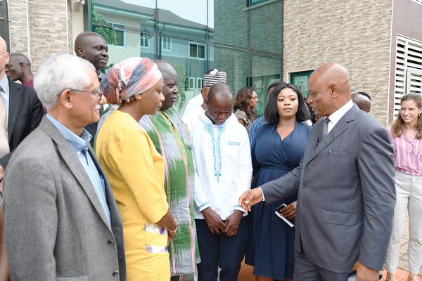Mr Jonas Chianu, (right), AFT Fund Coordinator of the AfDB, interacting with participants after the launch of the newly approved grant projects to be funded by the AfDB. Picture: EBOW HANSON