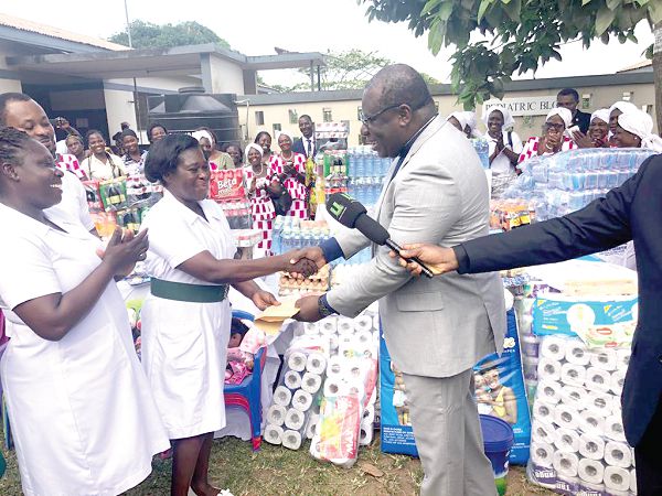  Rt Rev. Prof. J.O.Y. Mante (left) presenting the items to Mrs Stella Tekpetey, the acting matron of the Tetteh Quarshie Memorial Hospital 