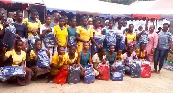 Madam Rebecca Kumi (right), Programme Officer with the beneficiaries