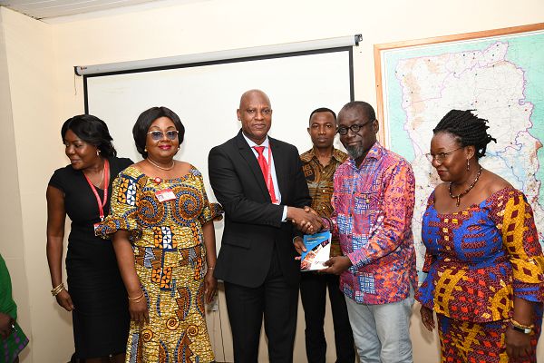 Nana Fredua Agyeman Ofori-Atta (2nd right) presenting a copy of the strategy plan to Mr Ato Afful looking on are from right Ms Adwoa Serwaa Bonsu, Editor, Graphic Showbiz, Mrs Mavis Kitcher, Mr Anane Adjei and Mrs Amy Appiah Frimpong. Picture: EBOW HANSON