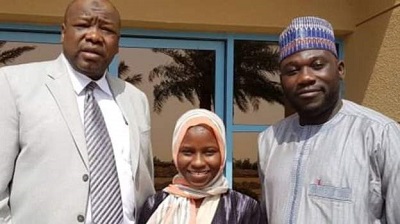 Zainab Aliyu (C) pictured with Nigerian officials in Jeddah shortly after her release from prison