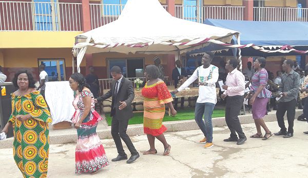    Mrs Hamilton (2nd left) with some staff members of the school dancing and singing praises to God