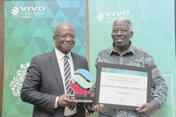  Mr Ben Hassan Ouattara (left), MD, Vivo Ghana Energy, presenting a citation and a framed photograph to Mr Samuel Obeng Frimpong, CEO, S.O. Frimpong Transport & Company Limited, as the Best Transporter for the year 2018. Picture: BENEDICT OBUOBI