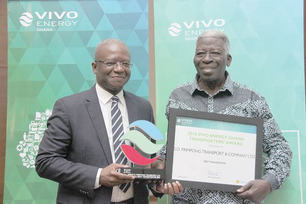  Mr Ben Hassan Ouattara (left), MD, Vivo Ghana Energy, presenting a citation and a framed photograph to Mr Samuel Obeng Frimpong, CEO, S.O. Frimpong Transport &amp; Company Limited, as the Best Transporter for the year 2018. Picture: BENEDICT OBUOBI