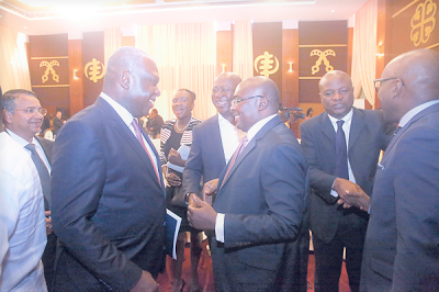 Vice-President Dr Mahamudu Bawumia chatting with Dr Eugene Owusu (left), the Special Advisor to the President on SDGs. With them are Mr Frank Adu Jr (right), Managing Director, CalBank, and Togbe Afede XVI (2nd right), a member of the Council of State