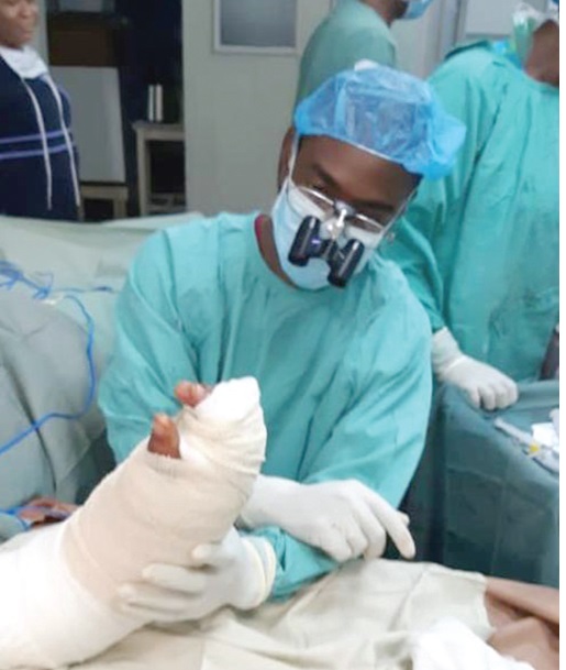 Doctors working on Amadu Awal’s severed wrist