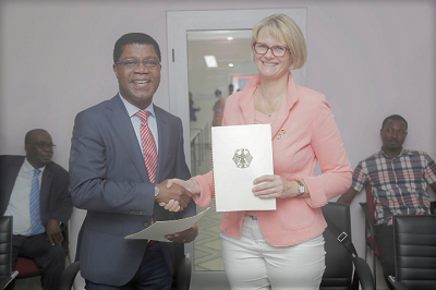 Mrs Anja Karliczek (right) and Mr Thierry Zomahoun, exchanging the signed document. Picture: EMMANUEL ASAMOAH ADDAI 