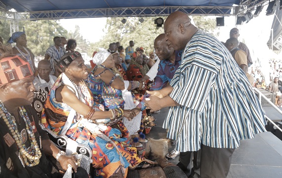  Mr Ishmael Ashitey (right), the Greater Accra Regional Minister, congratulating Djetse Abram Kabu Akuaku III (2nd left), President of the Ada Traditional Council, at the grand durbar of the 82nd Ada Asafotufiami Festival celebrations. With them is Mr Adzoteye Lawer Akrofi (2nd right), District Chief Executive (DCE), Ada West District. Picture: EMMANUEL ASAMOAH  ADDAI 