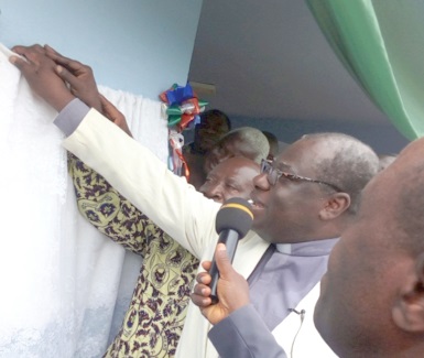 Rt Rev. Prof. J.O.Y. Mante, the Moderator of the PCG, unveiling the plaque after the dedication of the centre