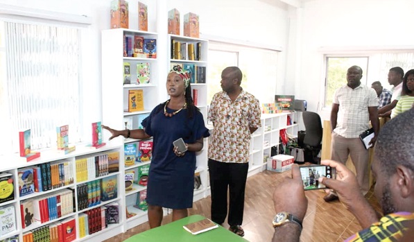 Madam Sylvia Arthur (left) explaining how the libraries will operate to some journalists at the Osu e-Ananse Library in Accra