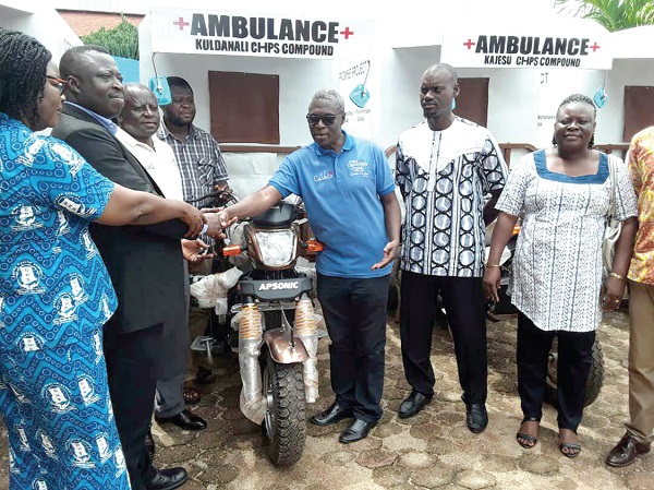  Mr George Baiden (3rd right) handing over the tricycle ambulances to Dr Otchere  (2nd left). Inset: The ambulances