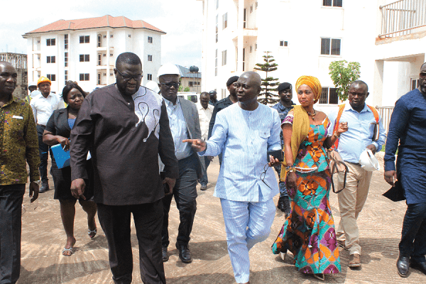 Mr Samuel Atta Akyea (middle) and Mr Kwabena Appiah (left) during the tour. With them is Ms Barbara Asher Ayisi (right), a Deputy Minister of Works and Housing