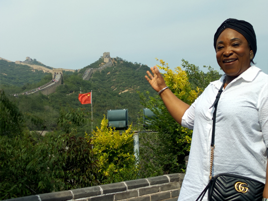 Ms Botchwey points at the Great Wall