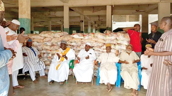 Some of the representatives of the Muslim community in Bawku offering prayers after they had received their share of the 100 bags of rice for the Eid-Ul Adha celebrations.