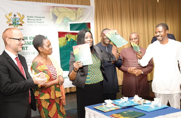 Mrs Janet Ampadu Fofie (3rd left), launching the report. Those with her are Dr Grace Bediako (2nd left), Dr Mohammed Sani Abdulai (right), Nana K. Adjei-Mensah (2nd right), acting Chief Director of the Ministry of Health, and Mr Matthias Feldmann (left). Picture: EBOW HANSON