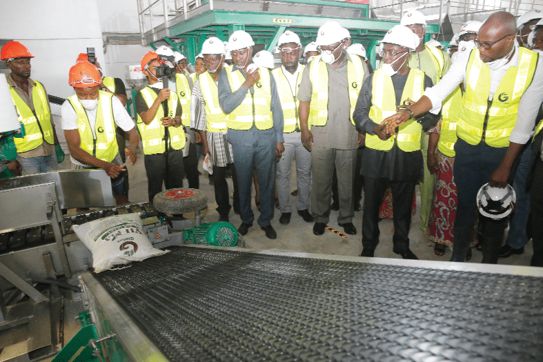 Vice-President Dr Mahamudu Bawumia (2nd right) and his entourage being briefed on  fertiliser bagging process at the factory by Rev. Foster Mawuli Benson (right), CEO, Glofert Limited