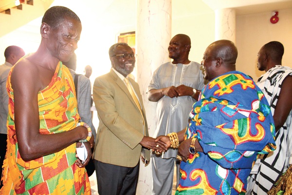 Dr Anthony Nsiah-Asare (2nd left) exchanging pleasantries with Oboaman Bofotia Boamponsem, the Krontihene of the Sunyani Traditional Area, who chaired the opening ceremony