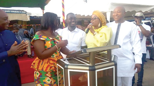 Mrs Marigold Assan (left) together with Mr Joseph Afankwa (2nd left), the Constituency Chairman, and Mrs Cynthia Morrison (2nd right) in a joyous mood after their public reconciliation. Looking on is Mr Horace Ekow Ewusi, a party stalwart in the Central Region.