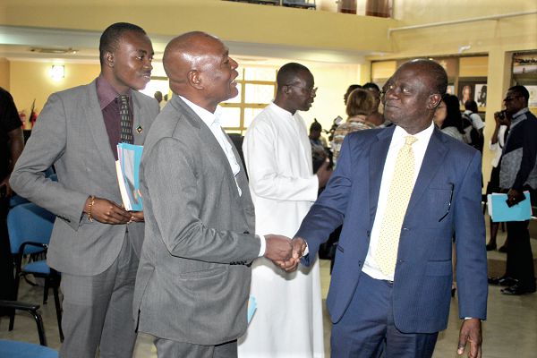 Professor George Gyan-Baffour (right) interacting with Mr Emmanuel Akrofi (2nd left), the Board Chairman of the Environmental Management Association of Ghana (EMAG), at the the high level inclusive development forum in Accra. Picture: GABRIEL AHIABOR