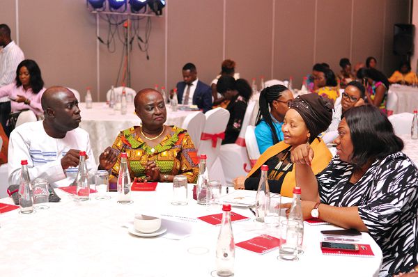 Mr Kwesi Eyison (left), explaining some points to Ms Lulu Xingwana (2nd right),  Mrs Stella Appenteng (2nd left), Member, TOUGHA, and Madam Eunice Ogbugo (right), President, Women in Business &amp; Tourism Ghana, during the Tourism Road Show in Accra. Picture: NII MARTEY M. BOTCHWAY